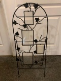 Wrought iron garden trellis with picture inserts