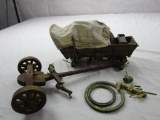 Reproduction miniature Conestoga wagon and cart base with wheels broken and in need of repair