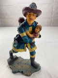 Plastic Fireman figure walking with small child