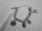 Monet silver-tone charm bracelet with 4 charms - 3 marked sterling