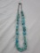 Turquoise stone necklace with silver-tone chain and clasp. 21