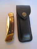 Buck 110 Folding Hunter Knife Made in U.S.A. in Leather Belt-Loop Holder