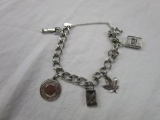 Monet silver-tone charm bracelet with 4 charms - 3 marked sterling
