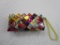 Folded candy wrapper clutch handbag with zipper enclosure Ecoist made in Mexico.