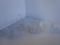 Lot of 4 clear cut glass items: sugar and creamer, miniature Easter basket, and small cup.