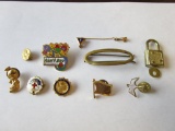 Lot of gold-tone service pins, lapel or hat pins, and other small items