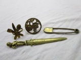 Lot of 4 brass items: 2 napkin rings, large reproduction diaper pin, and a letter opener