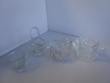 Lot of 4 clear cut glass items: sugar and creamer, miniature Easter basket, and small cup.