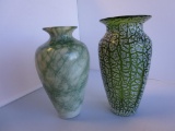 Lot of 2 green and white art glass flower vases. Approx. 7.5 and 8