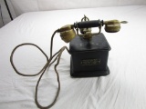 Vintage 1920's hand crank telephone from Paris, France. Brass in a black wood box.