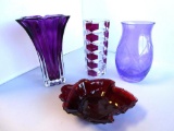 4 miscellaneous decorative glass pieces: 2 purple vases, geometric cranberry vase, red candy dish