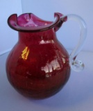 Vintage cranberry-color crackle glass pitcher with handkerchief edges 6.5