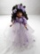 Porcelain doll with lavender dress and flowers made and signed by Linda Rick