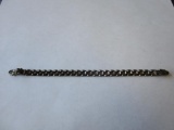Link bracelet with panther head fastener ends marked 925. Approx. 7