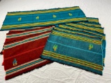 Set of nine woven and embroidered placemats and a table runner