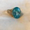 14 KT Gold-Plated Ring with Blue Center Gem and Smaller Diamond Accent Gems Size 8 | 9.07 grams