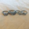 Lot of 4 Misc. Silver-Toned Rings with Faux-Diamond Center Gems