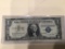 1957 A $1.00 Blue Seal U.S. Bill in circulated condition serial number B06627176A