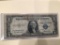 1935 E $1.00 Blue Seal.U..S. Bill in circulated condition serial number F49909683I