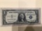1957 B $1.00 Blue Seal.U..S. Bill in circulated condition serial number W66469129A