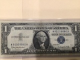 1957 B $1.00 Blue Seal U.S. Bill in circulated condition serial number W91009880A