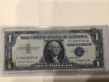 1957 B $1.00 Blue Seal U.S. Bill in circulated condition serial number X70938760A