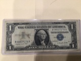 1957 A $1.00 Blue Seal U.S. Bill in circulated condition serial number B06627176A