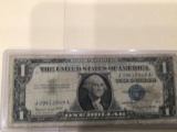 1957 A $1.00 Blue Seal U.S. Bill in circulated condition serial number J39612849A