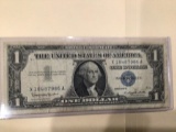 1957 B $1.00 Blue Seal.U..S. Bill in circulated condition serial number X18487986A