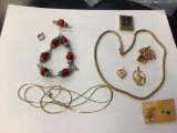 Lot of Gold Tone and Silver Tone Jewelry, includes necklaces, pins, pendants ring and bracelet