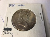 1957 Franklin Half Dollar in A.U. condition with some toning, 90% Silver