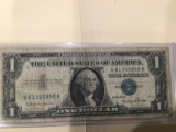 1957 B $1.00 Blue Seal U.S. Bill in circulated condition serial number U61355950A