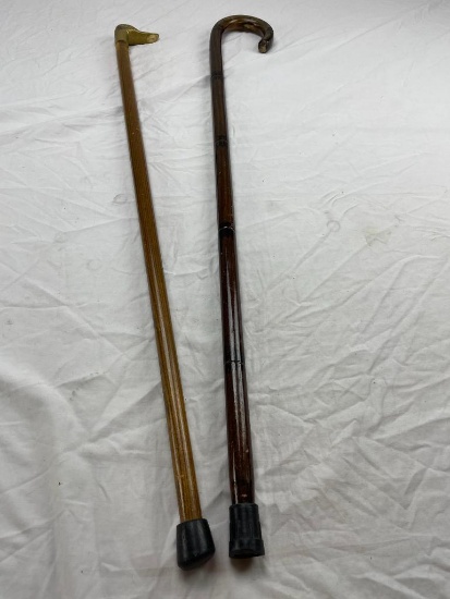 Two wood walking canes