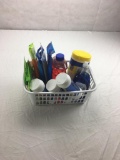 Bin of miscellaneous cleaning supplies: Lysol, Dial, Windex, Dust Cloth