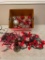 Box lot of red and white holiday items: lights, angel tree topper, and ornaments