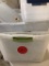 three large clear totes with lids and two small clear totes with lids.