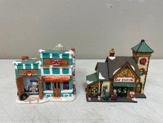 Two ceramic gas station figurines and a fancy old-time storage box