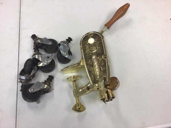 Lot of two items, Brass Wine Bottle Cork Remover and five Wheels.