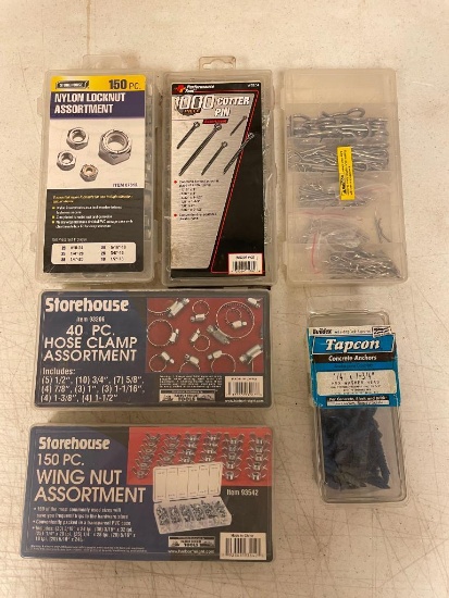 Assortment of fastening tools: locknuts, wing nuts, clamps, cotter pins, and anchors