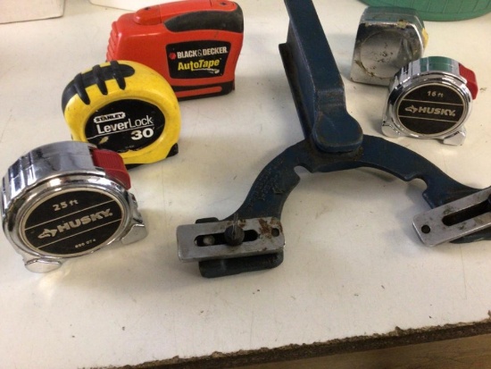 Lot of five tap measures ranging from 16 to 30 feet, one is Black and Decker AutoTape.