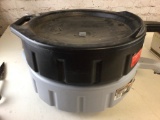 Lot of two oil collectors when draining oil during oil change.