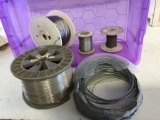 Four rolls or spools of various gage lockwire and one spool of cable wire