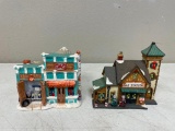 Two ceramic gas station figurines and a fancy old-time storage box