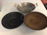 Lot of three gold panning pans, one plastic, two are metal with one of them rusted.