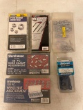 Assortment of fastening tools: locknuts, wing nuts, clamps, cotter pins, and anchors