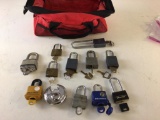 Lot of 12 locks (mostly Master) with keys, includes bag for storage.