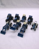 (8) Ertl 1/64 Scale Die Cast Metal Ford Tractors.
