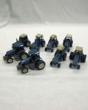 (6) Ertl 1/64 Scale Die Cast Metal Ford Tractors & (2) Smaller New Holland
