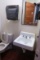 Wall Sink, Paper Towel Dispenser  & Toilet.