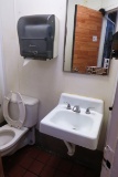 Wall Sink, Paper Towel Dispenser  & Toilet.